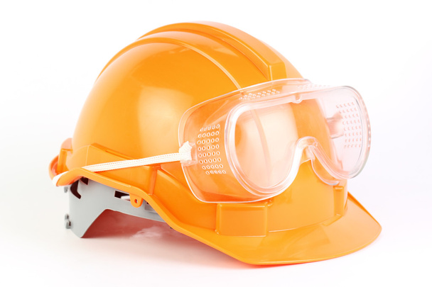 Casco y gafas de seguridad naranja
 - Foto, imagen