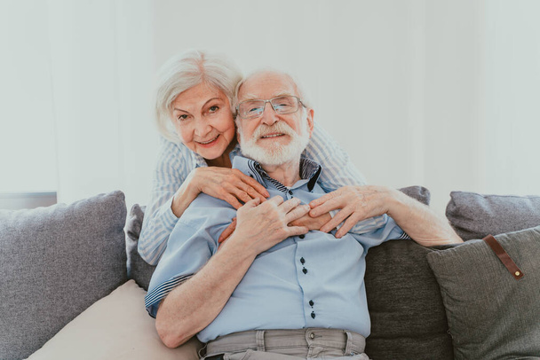 Senior couple together at home, happy moments - Elderly people taking care of each other, grandparents in love - concepts about elderly lifestyle and relationship - Φωτογραφία, εικόνα