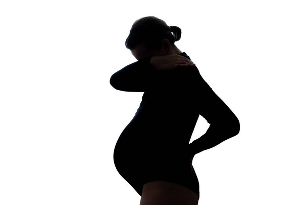 Jonge zwangere vrouw depressie bedekken haar gezicht. - Foto, afbeelding