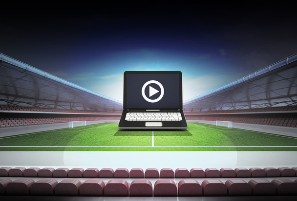 laptop internet football watch in midfield of football stadium - Photo, Image