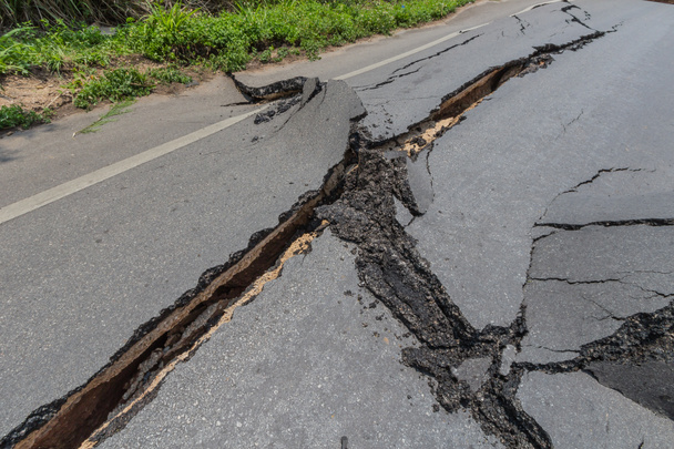 Layer of broken asphalt road at rural areas - Photo, Image