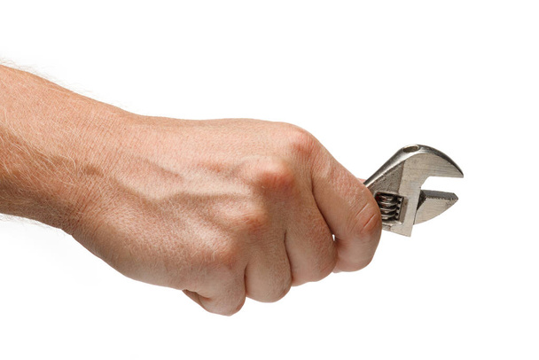 Nastavitelný klíč nástroj v rukou na bílém izolovaném pozadí - Fotografie, Obrázek