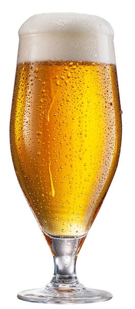 Glass of pale lager beer with water drops on cold glass surface isolated on white background. File contains clipping path. - Zdjęcie, obraz