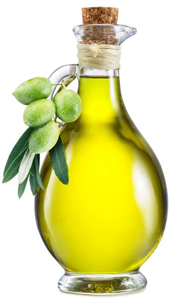 Carafe with olive oil decorated with fresh olive fruits. File contains clipping path. - Фото, изображение