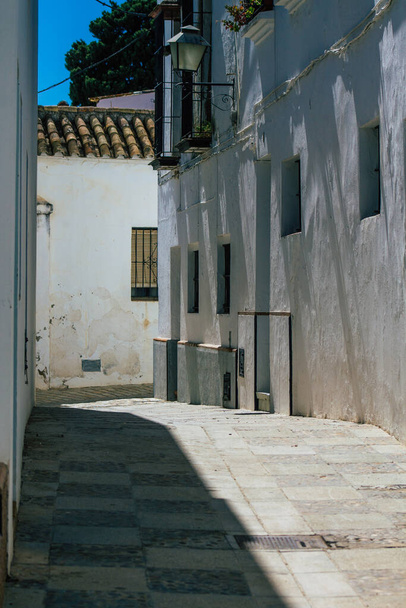 Carmona Spain July 14, 2021 Narrow street in town of Carmona called The Bright Star of Europe, the town shows a typical narrow and meandering Arabic layout which will transport you to a distant past - Photo, Image