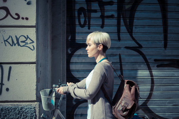 Hipster woman with bike - Zdjęcie, obraz