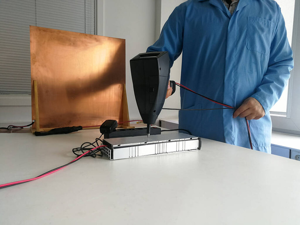 Electrostatic discharge immunity test setup for electromagnetic compatibility EMC testing and engineer testing electronic product - Foto, imagen