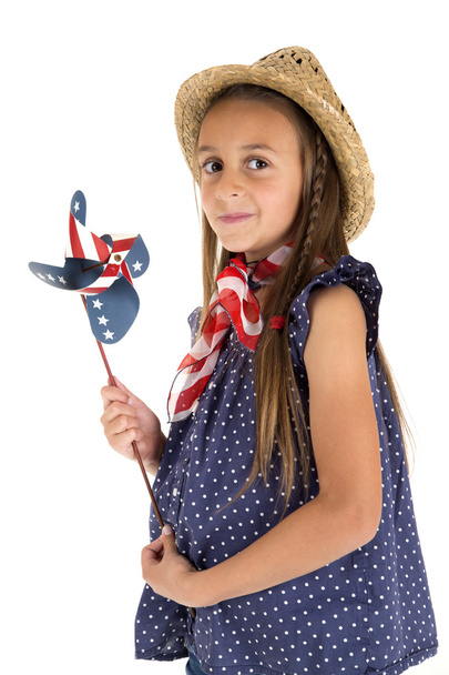 beautiful young girl holding a patriotic windmill - Fotó, kép