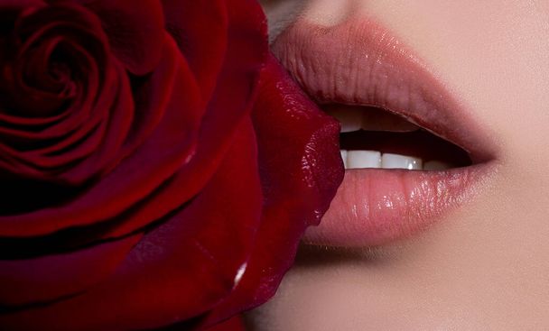 Sexy full lips with red rose. Gloss of lips and womans mouth. Sensual lips. - Φωτογραφία, εικόνα