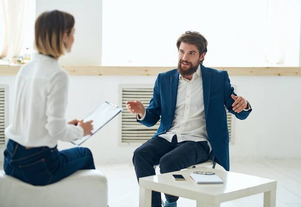 man communicates with woman job interview office emotions - Valokuva, kuva