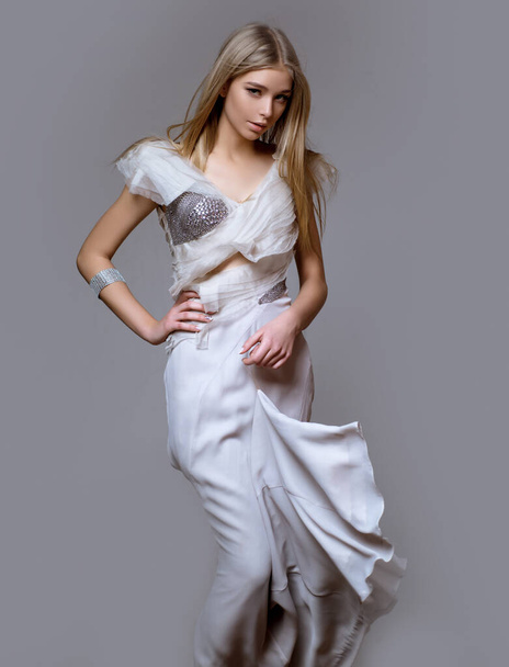 Fashion art studio portrait of beautiful elegant young woman. - Фото, изображение