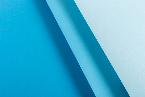 Diseño de material de papel plegado azul colorido. Vista superior, plano. - Foto, imagen