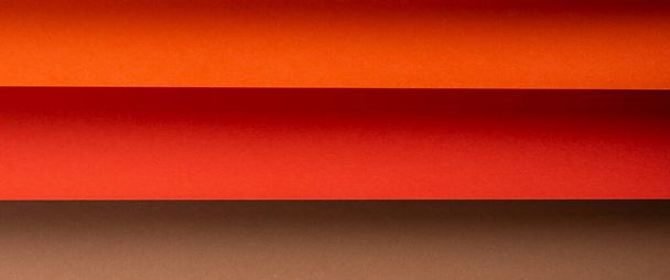 Colored horizontal background from folded paper material. Top view, flat lay. Banner. - Fotó, kép
