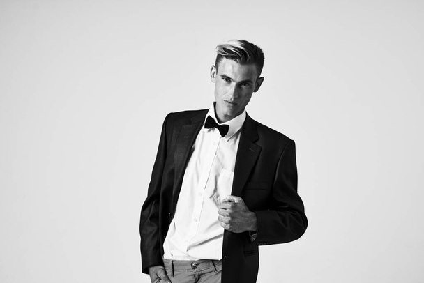 man in suit bow tie fashion hairstyle cropped view - Photo, Image
