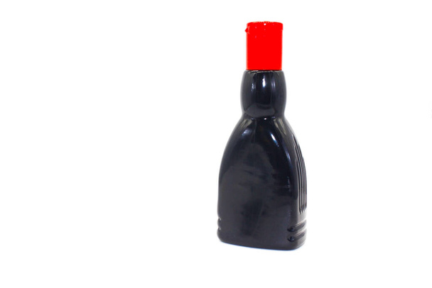 A picture of oil bottle isolated on white background with selective focus - Φωτογραφία, εικόνα