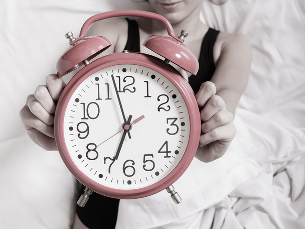Alarm clock with female hands - Фото, зображення