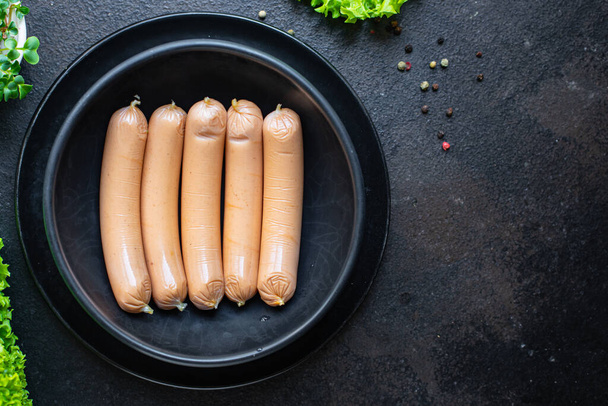 sausage pork beef or chicken fast food semi-finished product snack on the table meal snack top view copy space for text food background rustic - 写真・画像