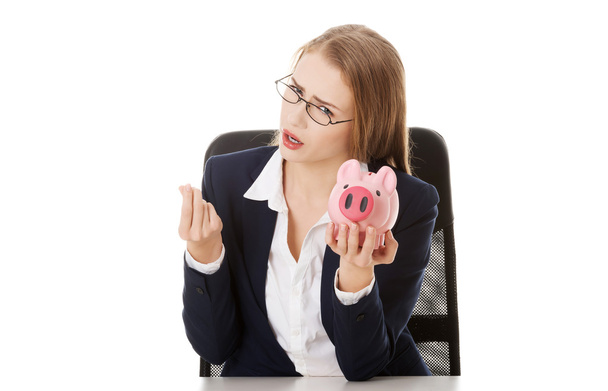 Business woman with piggy bank. - Zdjęcie, obraz