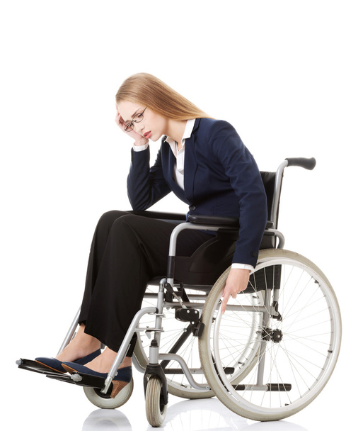 Woman sitting on wheelchair - Foto, Imagen