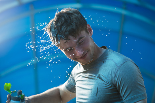 Man  splashing water with face - Fotó, kép
