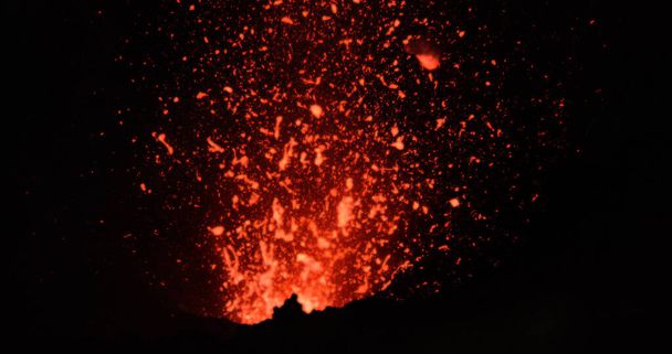 CLOSE UP: Dangerous chunks of searing hot magma comes flying out of volcano. - 写真・画像