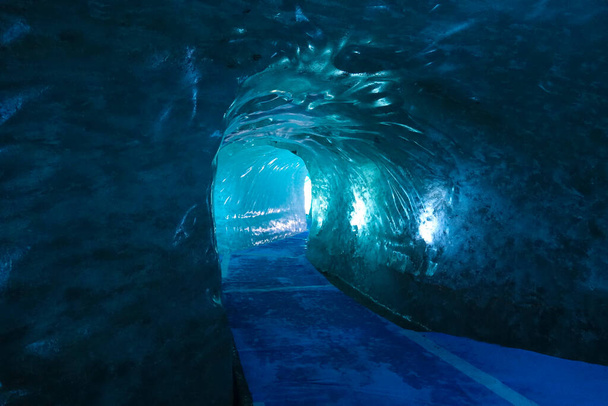 Empty corridor leads through the glacier slowly melting due to climate change. - Photo, image