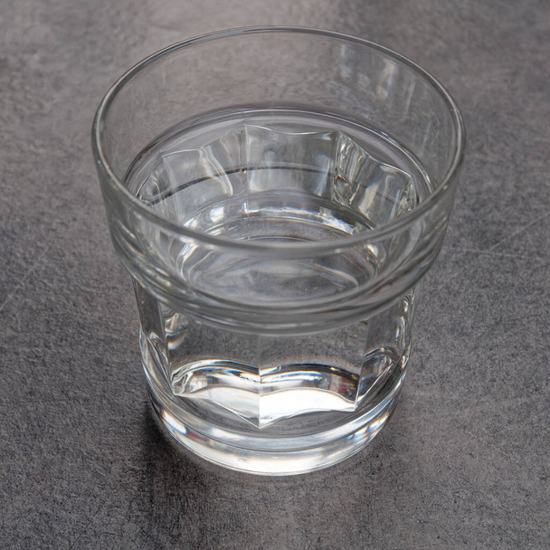 crystal clear glass of water on grey marble table background - Photo, Image