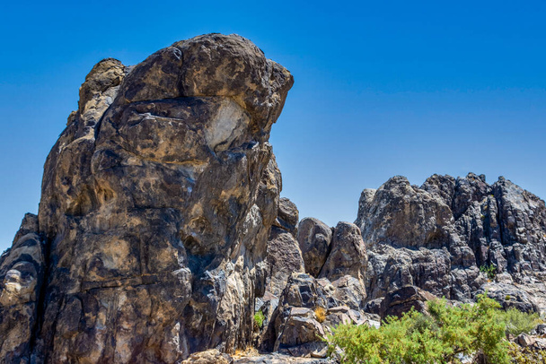 A rocky landscape on a sunny day - Фото, изображение