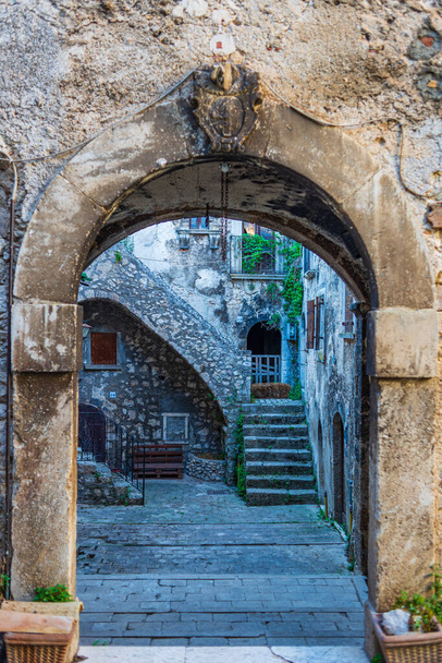 Santo Stefano di Sessanio medieval village details, historical stone buildings, ancient gate, old city stone architecture. Abruzzo, Italy. - Photo, image