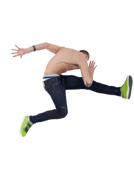 Photo d'un jeune homme posant dans un mouvement de danse de saut en hauteur
 - Photo, image