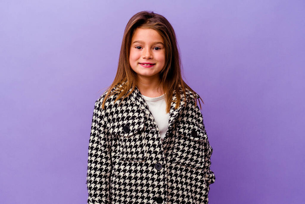 Little caucasian girl isolated on purple background Little caucasian girl isolated on purple background happy, smiling and cheerful. - Photo, Image