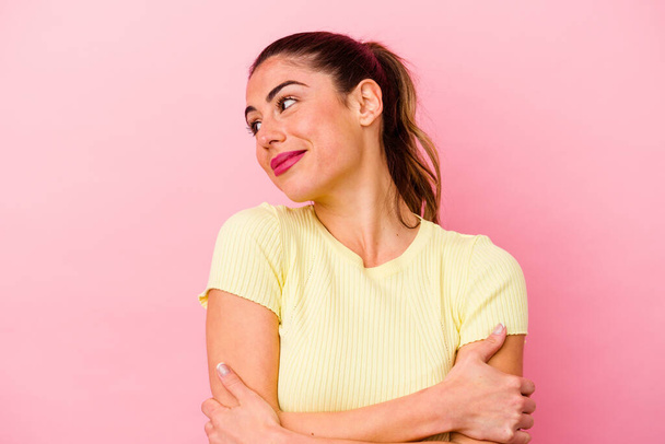 Young caucasian woman isolated on pink background feels proud and self confident, example to follow. - Photo, Image
