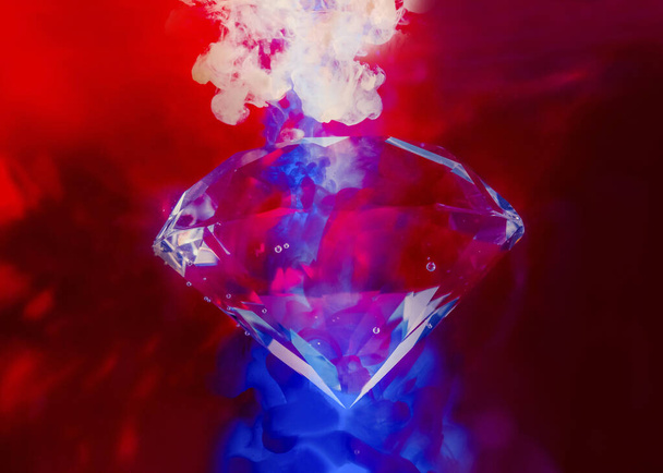Photo of shining red toned diamond under water with air bubbles and color neon ink splashes. - Fotoğraf, Görsel