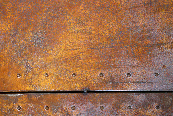 rusty iron texture. Rustic iron plate with rivets. - Photo, Image