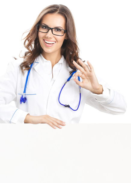 Doctor showing blank signboard, isolated  - Foto, imagen