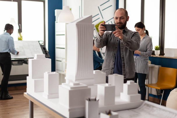 Architect profession man looking at maquette layout - Φωτογραφία, εικόνα