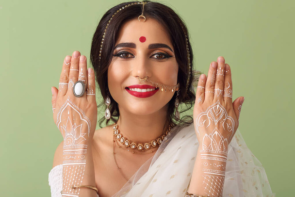 Beautiful Indian woman on color background - Fotó, kép