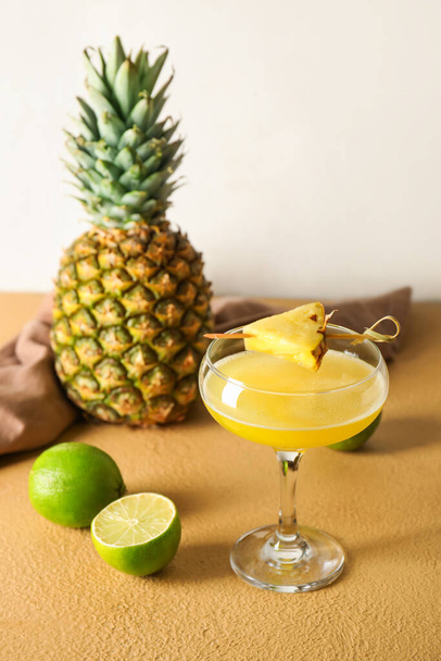 Glass of pineapple daiquiri cocktail on light background - Photo, image