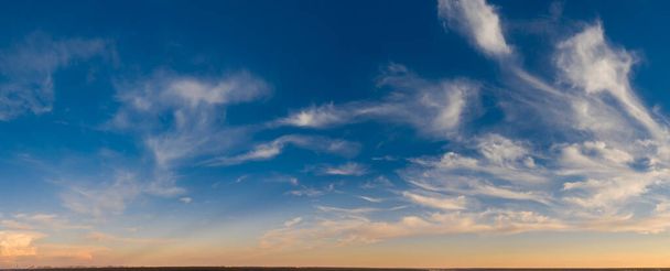 Dawn or sunset, panorama. Drone view of bright clouds sky and sun. - Photo, Image