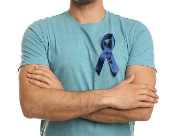 Man with blue ribbon on white background, closeup. Urology cancer awareness - Фото, зображення