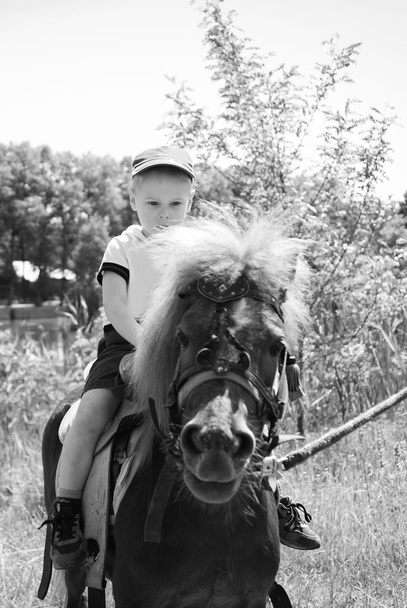 Boy riding pony - Photo, Image