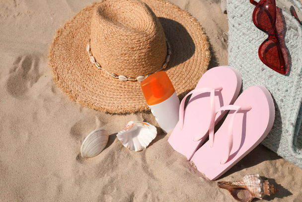 Bag and beach accessories on soft sand - Photo, Image