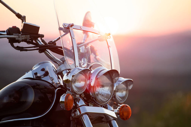 Motorcycle detail closeup front fork and headlight. Travel and sport, speed and freedom concept - 写真・画像