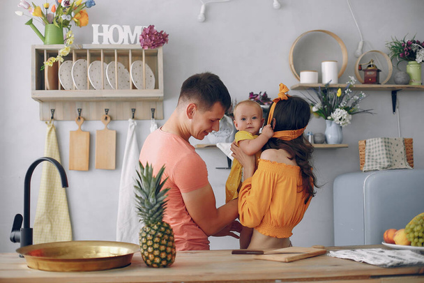 Beautiful family prepare food in a kitchen - Valokuva, kuva