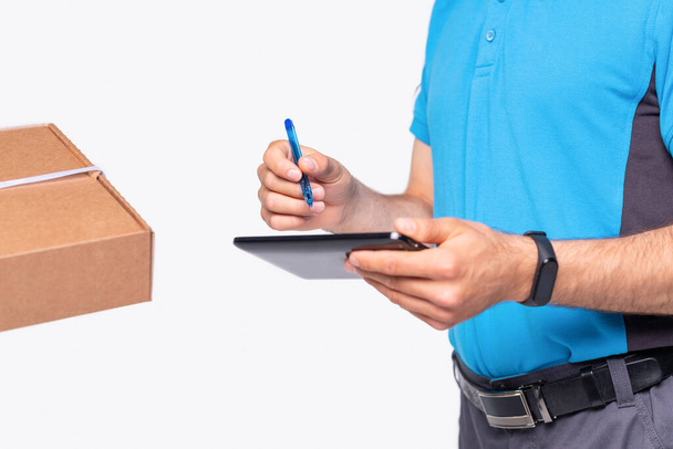 Concept of courier delivers package for people, he is making notes of the place and time of receipt of goods. - Foto, imagen