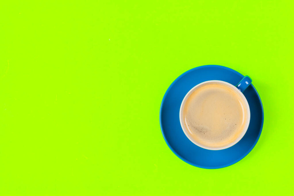 cup of coffee and saucer on color background - Foto, imagen