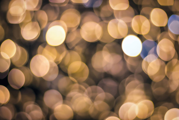 Christmas lights blured background. Light bokeh from Xmas decoration. Abstract holiday backdrop. - Photo, Image
