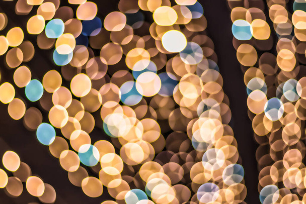 Christmas lights blured background. Light bokeh from Xmas decoration. Abstract holiday backdrop. - Foto, imagen
