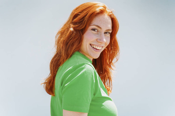 Ginger redhead girl portrait isolated on background - Photo, Image