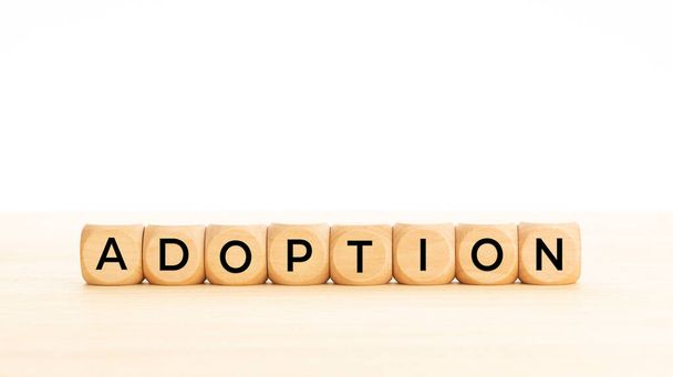Adoption word on wooden blocks. Copy space. White background - Foto, immagini